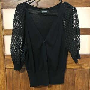 Black size small short sleeve cardigan.